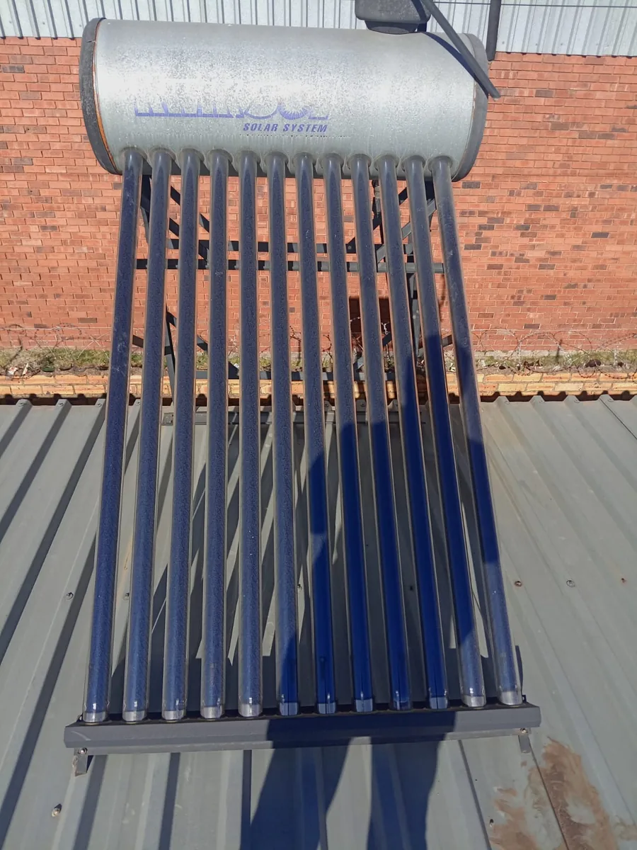 100 litre evacuated tube solar geyser system positioned on a residential roof