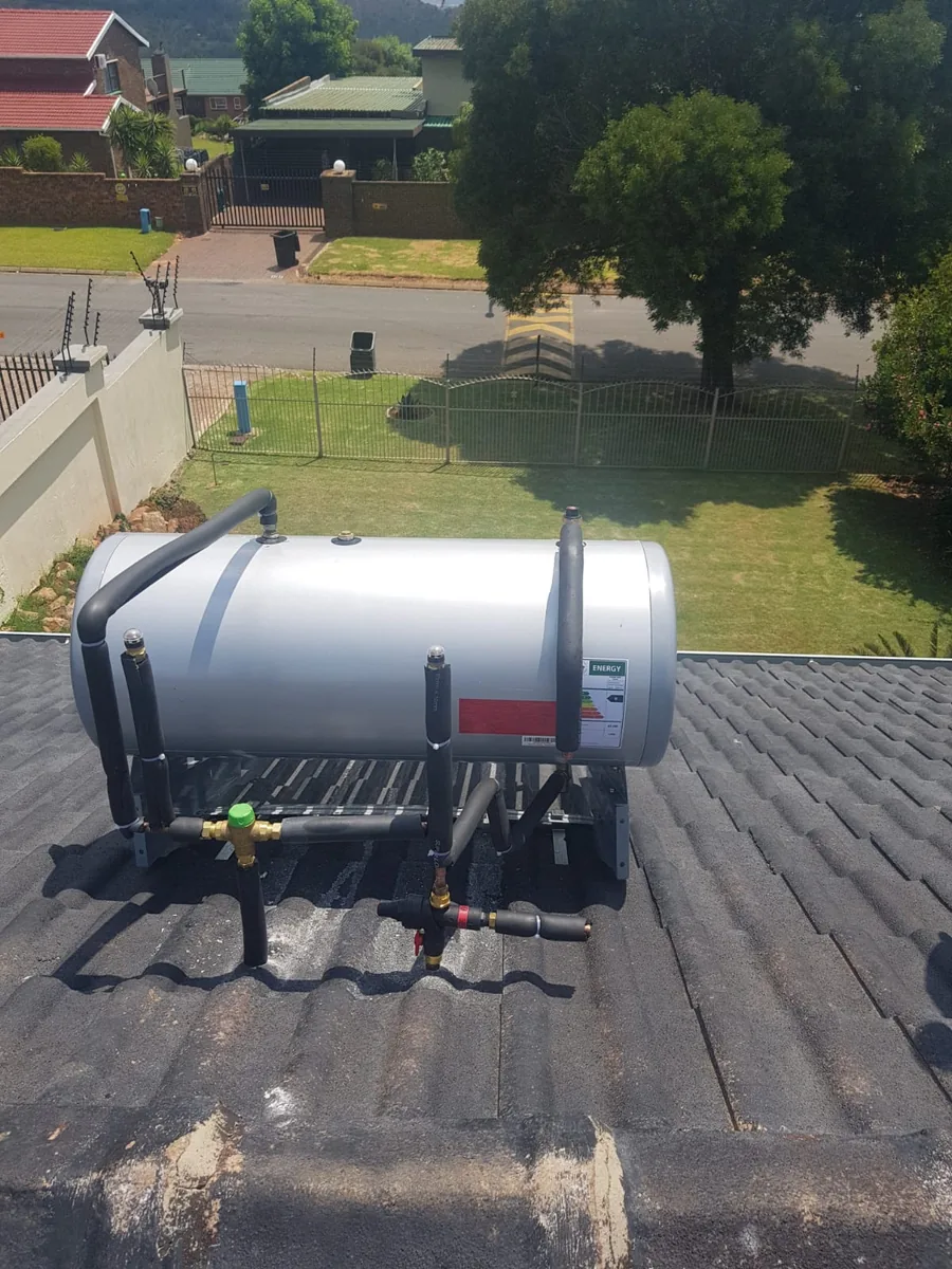 100 litre solar geyser conversion installed on a tiled roof with insulated pipework